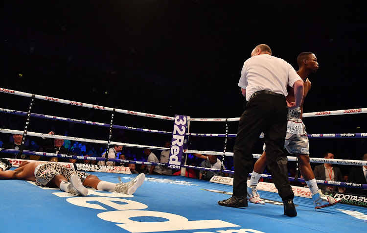 Siboniso Gonya is knocked out by Zolani Tete with his first punch after only a few seconds during their WBO Bantamweight Championship.