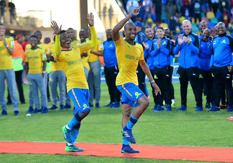 Percy Tau accompanied Tiyani Mabunda of Mamelodi Sundowns to receive his medals with dance during the Absa Premiership 2017/18 football match between Bloemfontein Celtic and Mamelodi Sundowns at Dr Petrus Molemela Stadium, Bloemfontein on 12 May 2018.