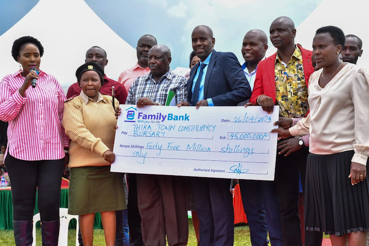Thika MP Alice Ng'ang'a (left) with leaders and parents during the issuance of sh 45 million bursaries to some 10,000 needy students in Thika town.