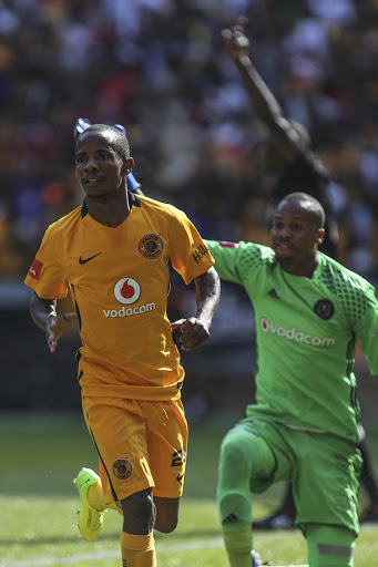 Kaizer Chiefs' winger Joseph Molangoane celebrates as Orlando Pirates goalkeeper Brighton Mhlongo looks on in disbelief during the Absa Premiership match between the Soweto giants at FNB Stadium on March 04, 2017 in Johannesburg, South Africa.