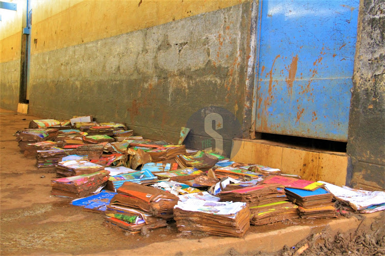 Smudged books outside a muddy classroom at Mathare North Primary School affected by floods, May 3, 2024.