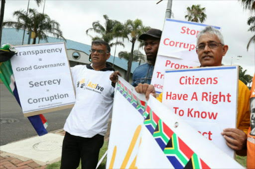 Right to know activists, Desmond Kylas, Nkazimulo Gabuzo and Dhanashwar Basdew were amongst 100 activists protesting near the ICC where a coulcil meeting was taking place. Picture: JACKIE CLAUSEN