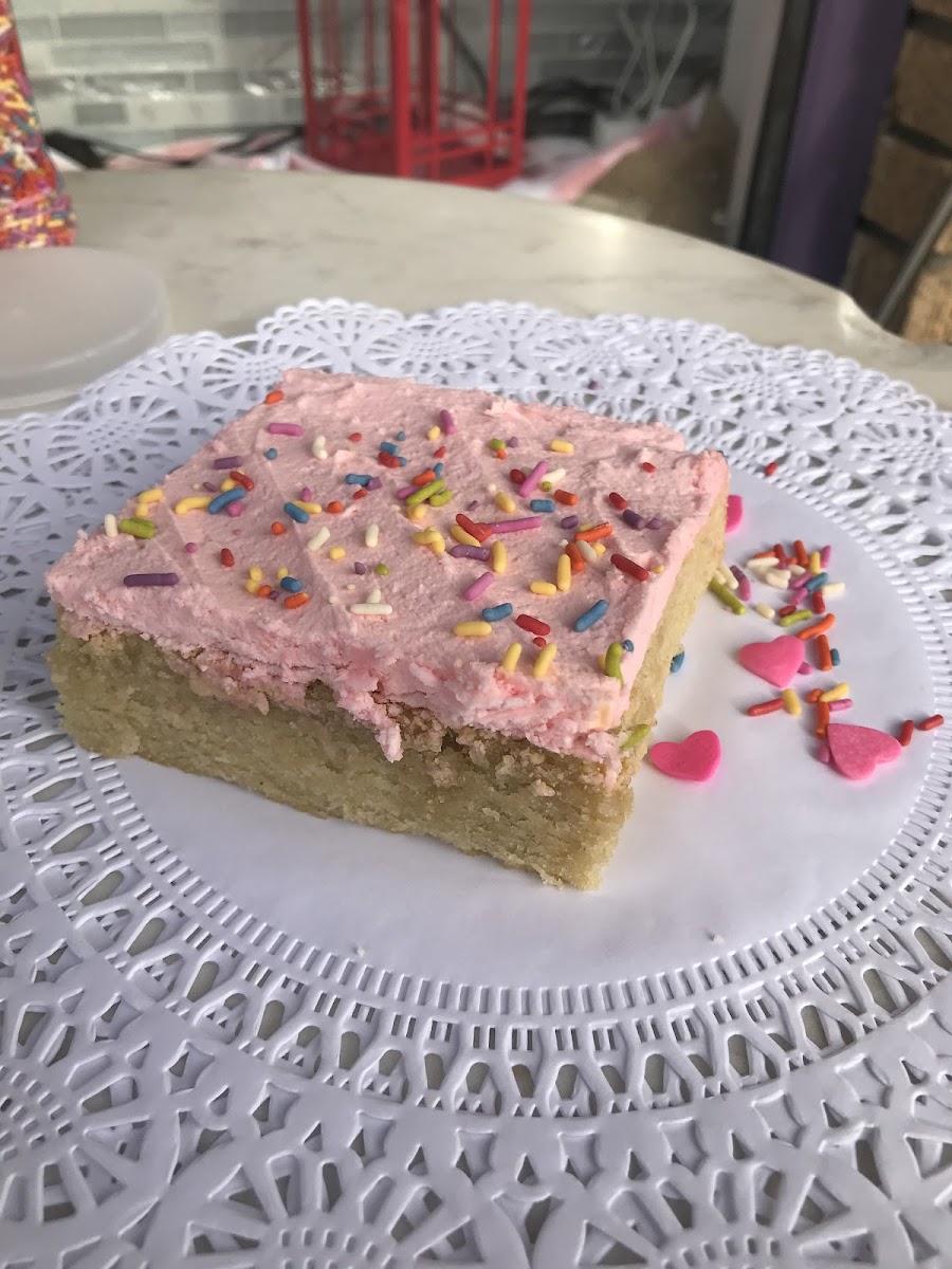 A deliciously moist vanilla cake topped with a strawberry frosting.