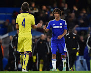 A file photo of Maribor's defender Marko Suler (L) shaking hands with Chelsea's Dutch defender Nathan Ake (R) at the end of the UEFA Champions League, Group G, football match between Chelsea and Maribor at Stamford Bridge in London on October 21, 2014. Chelsea won the game 6-0.