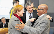 President Jacob Zuma, his Finnish counterpart, Tarja Halonen, and former British prime minister Gordon Brown share a joke at the start of a meeting on global sustainability at the UN headquarters in New York yesterday.