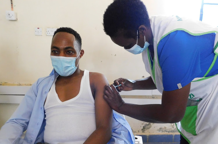 A health worker receives the Covid-19 jab at the Meru Level 5 Hospital