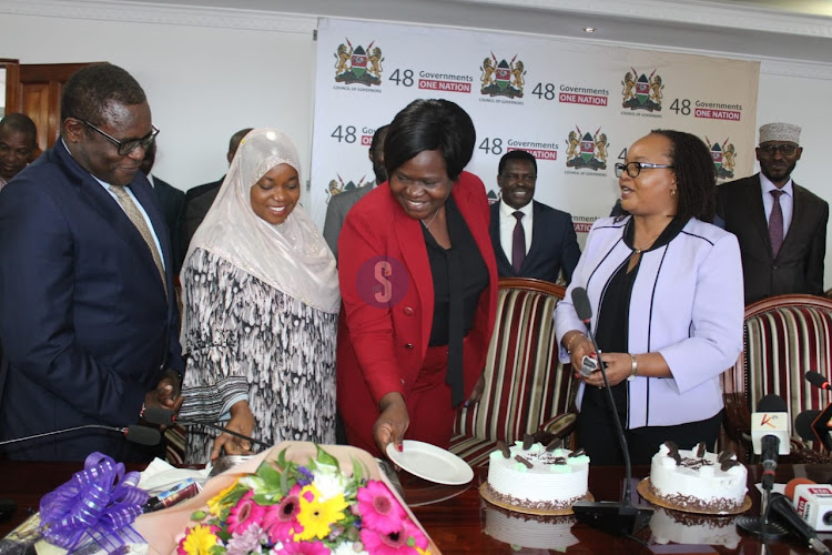 Bungoma Governor Kenneth Lusaka, Homa Bay Governor Gladys Wanga and Council of Governors chairperson Anne Waiguru during a surprise party to celebrate her (Waiguru's) birthday after a full council meeting to discuss the ongoing doctors strike at the CoG headquarters in Nairobi on April 16, 2024