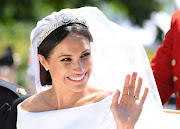The Duchess of Sussex's veil was held in place by a diamond bandeau tiara. Originally made in 1932 for Queen Mary, the focal point is a detachable brooch that dates back to 1893.