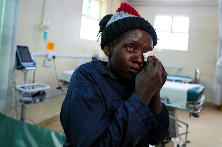 Evangeline Mbone, 32, a survivor reacts upon receiving treatment at the Naivasha Sub-county Hospital, for injuries she suffered after heavy flash floods wiped out several homes when a dam burst, following heavy rains in Kamuchiri Village of Mai Mahiu, in Naivasha, Nakuru County, Kenya April 29, 2024.