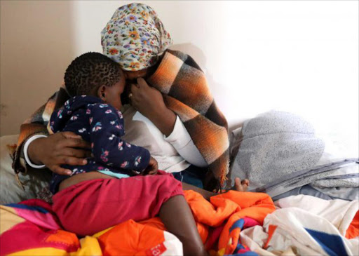 SHATTERED: Siphokazi Ntyapa mourns the death of her husband, who was shot and killed in front of their two-year-old grandson Lusenathi Mputha on the Gonubie Main Road on Saturday Picture: SIBONGILE NGALWA