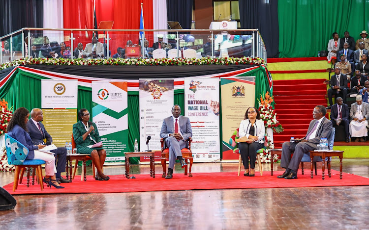 Salaries and Remuneration Commission (SRC) chairperson Lyn Mengich (left), President William Ruto, COG chairperson Ann Waiguru and former chief justice David Maraga during the Third National Wage Bill Conference 2024 at the Bomas of Kenya on April 17, 2024.