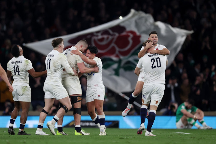 England's Marcus Smith celebrates with George Martin after beating Ireland.