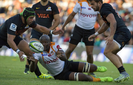 South Africa's Cheetahs hooker Teboho Mohoje (C) vies for the ball with Argentina's Jaguares player Lucas Noguera Paz (L) during their Super Rugby match at Jose Amalfitani stadium in Buenos Aires, Argentina on March 18, 2017.
