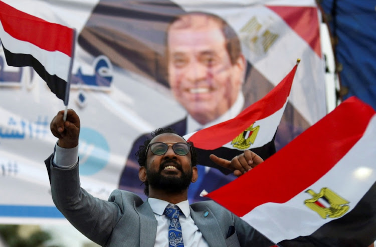 A supporter of Egyptian President Abdel Fattah al-Sisi reacts after presidential election results in Cairo, Egypt, December 18 2023. Picture: MOHAMED ABD EL GHANY/REUTERS