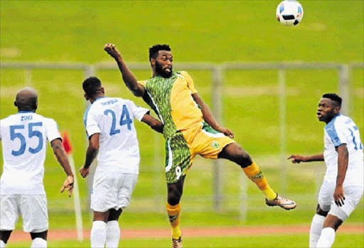 HIGH JINKS: Golden Arrows’ Mwape Musonda heads the ball from Chippa United players during their Premiership match at Chatsworth Stadium on Saturday. Chippa scored twice in the second half to win the showdown Picture: GALLO IMAGES