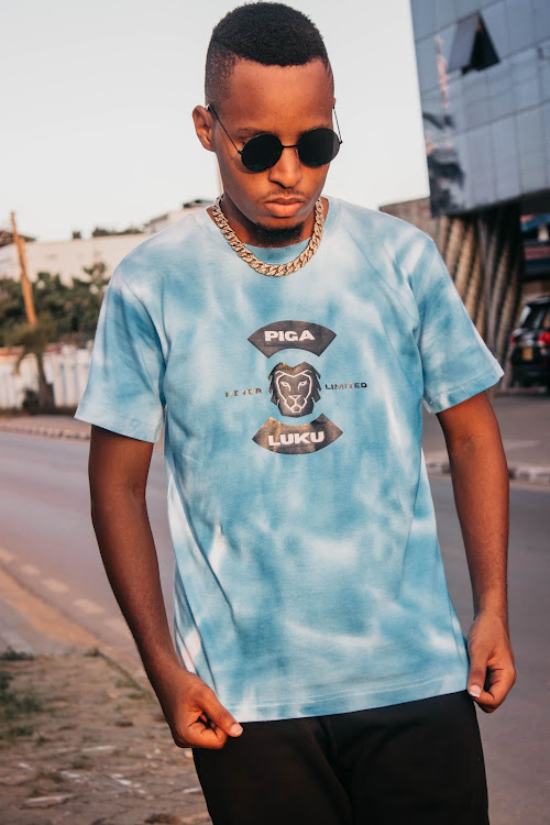 A photo of a model showcasing the limited edition Blue tye dye T-shirt from the iconic streetwear fashion brand PigalukuCampaign.