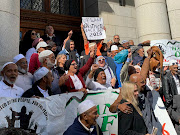 District Six claimants celebrated outside the high court in Cape Town on April 17 2019 after the absent land reform minister, Maite Nkoana-Mashabane, was ordered to return to court.