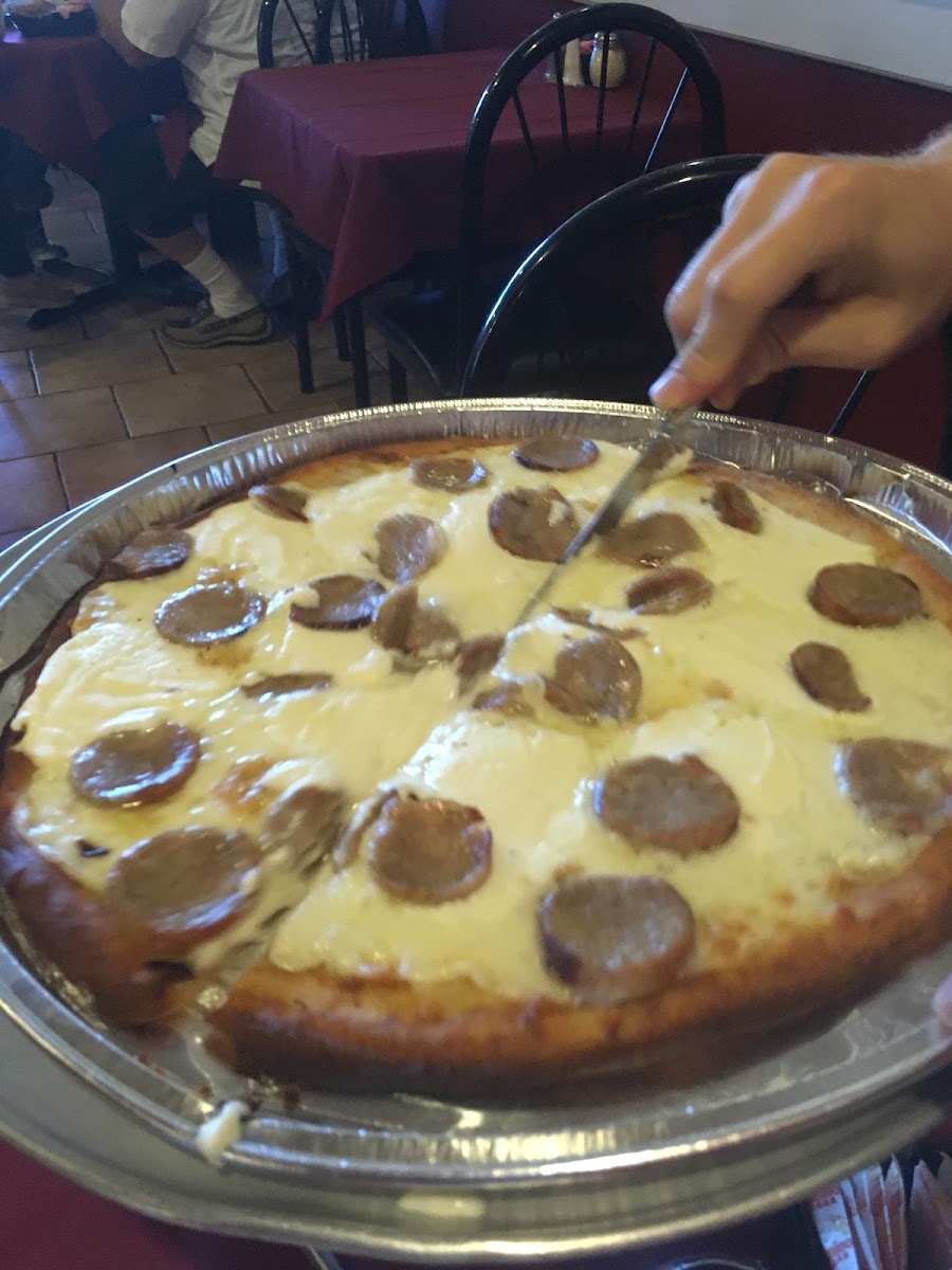 White pizza with sausage. Great crust, cheese, and garlic, but would not get the sausage again