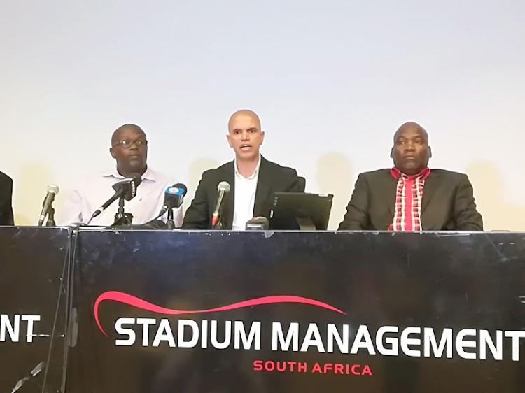 Former Premier Soccer League (PSL) referee and general manager Andile "Aces" Ncobo is flanked by Fanyana Sibanyoni and Xolani Mtumtum during a press conference at FNB Stadium on Tuesday March 13 2018.