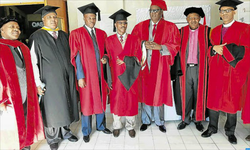 SERVING SOCIETY: Chief Mthuthuzeli Makinana, second from the right, with the six prominent leaders in society who were bestowed a PhD in leadership and governance by the Trinity International Bible University in Port Elizabeth last Friday. They are Sindile Herbert Toni, King Dalimvula Matanzima of Western Thembuland, King Mpendulo Sigcawu of the AmaXhosa kingdom, Zwelinzima Vavi, Mbulelo Mvubu and King Peter Cardi of the Khoisan in Cape Town