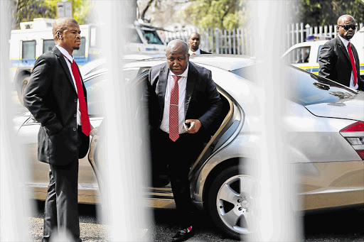 LEGAL SUIT: EFF Leader Julius Malema alights from a Mercedes-Benz outside the Polokwane High Court where he made a brief appearance