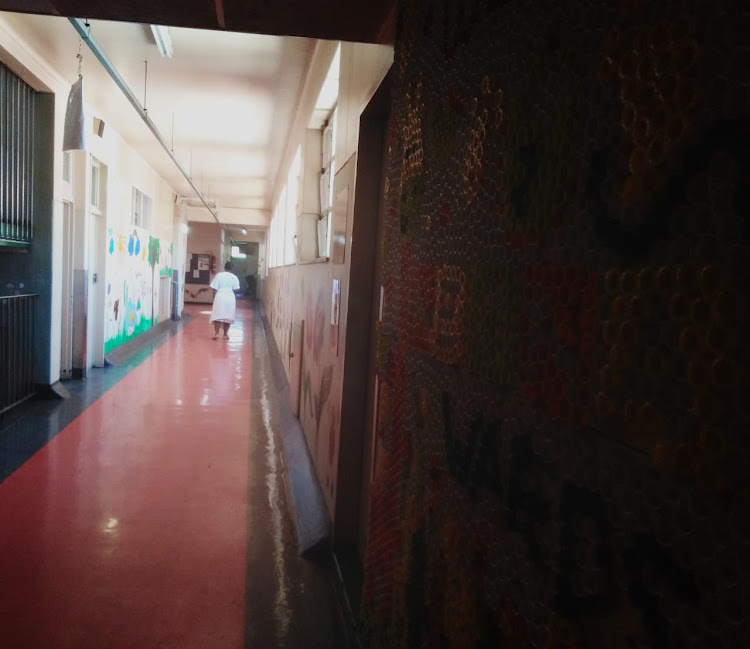 A new mother walks down a corridor at the Rahima Moosa Mother and Child Hospital in Coronationville, Johannesburg, on November 8, 2018. Nine babies died at the facility earlier this year.