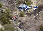 A French gendarme helicopter flies over the crash site of an Airbus A320, near Seyne-les-Alpes. REUTERS