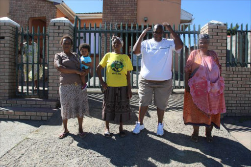 SHOCKING: Residents of Unit 3 in Mdantsane have been living without electricity for three weeks after electric cables were damaged during a road upgrading project. From left are Nocwaka Bavuma, Vuyiseka Hashe, Zola Gwazela and Nontobeko Xhelo