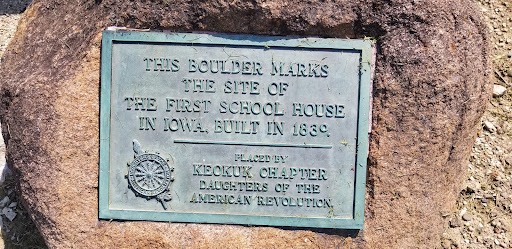 This boulder marks the site of the first school house in Iowa, built in 1830