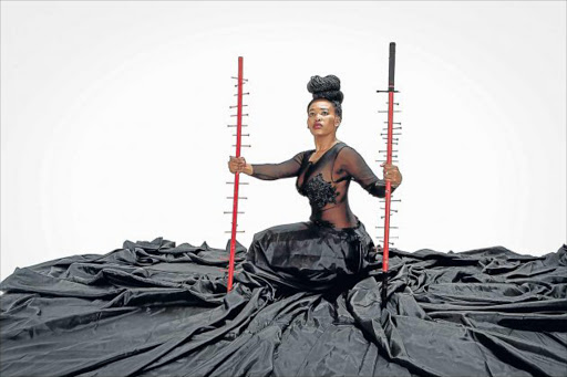 BACK TO AFRICA: In her performance Khanyisile Mbongwa rails against the double subjugation of black women by missionary-driven Christianity Picture: SUPPLIED