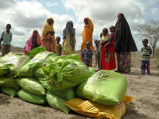 Residents of Balambala constituency, Garissa county, receive relief food on April 10 last year /FILE