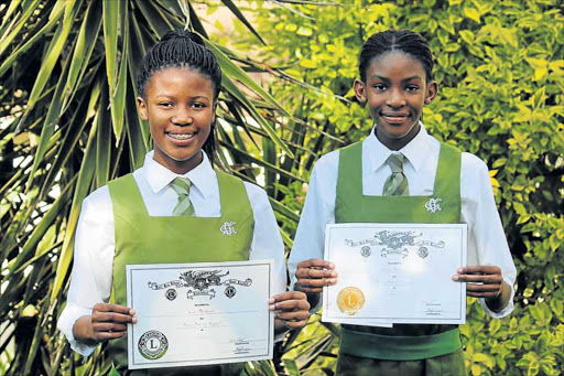 SUCCESS: The annual Port Rex Music Eisteddfod was held in East London last week. Cebokazi Mtshemla (Grade 10) played a Faure solo violin piece for which she was awarded a silver. Younger sister, Nceba (Grade 8), achieved a bronze for her cello performance PICTURE: SUPPLIED