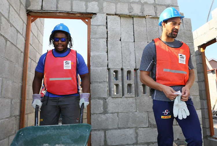 Stormers players Scarra Ntubeni (left) and Dillyn Leyds spent part of Mandela Day helping Habitat for Humanity to build houses in Mfuleni, Cape Town on July 18, 2018.