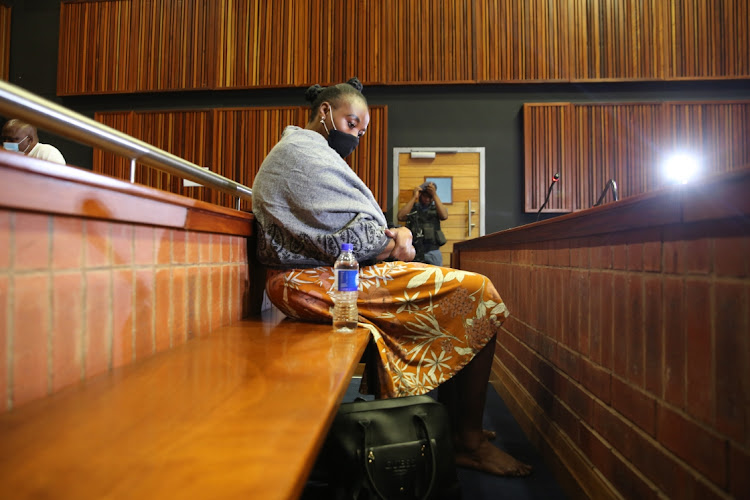 Former police officer, Nomia Rosemary sits in the dock ahead of receiving judgement in the high court sitting in Palm Ridge.