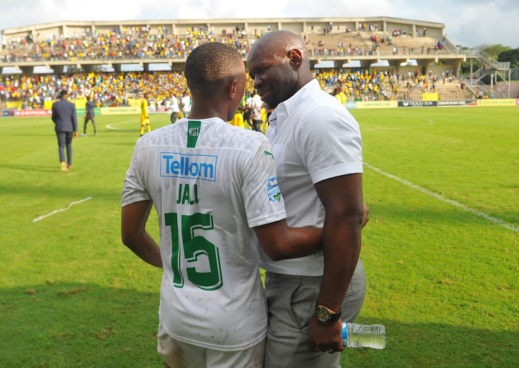 A file photo of Mamelodi Sundowns combative midfielder Andile Jali sharing a light moment with Steve Komphela after a match.