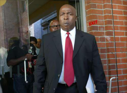Mbulelo Goniwe, ANC Chief Whip attending the Travelgate court hearing at the Cape Town Magistrates court. Pic: Terry Shean. 18/02/2005. © Sunday Times ANC chief whip, mbulelo goniwe leaves the cape town magistrates court where other MPs appeared on travelgate charges pic TERRY SHEAN 18/2/05