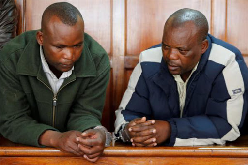 Samuel Kamau (R) and his brother Henry Muiruri Karanja (L), suspected owners of a six-storey building that collapsed after days of heavy rains in Huruma neighbourhood stand handcuffed in the dock at the Chief Magistrates Court in Milimani, Nairobi, Kenya May 3, 2016. Photo/REUTERS