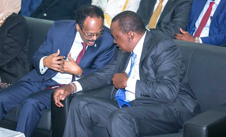President Farmajo (L) with Kenya's President Uhuru Kenyatta (R) ahead of his swearing in Wednesday in the Somali capital, Mogadishu.