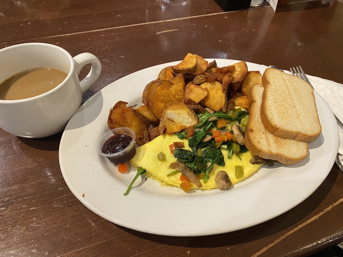 Two egg omlet with homefries and gf toast with jam