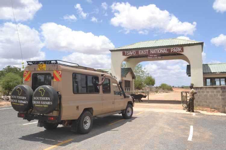 A Southern Cross tour van carrying domestic tourists to Tsavo East National Park for a game drive