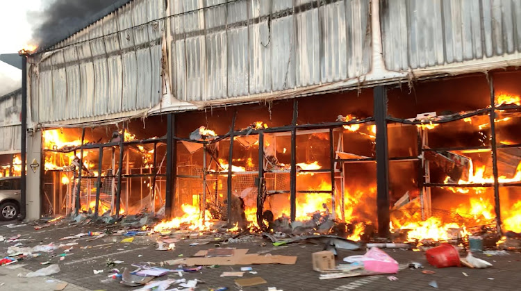 A fire engulfs Campsdrift Park, which houses Makro and China Mall, following protests that have widened into looting in Pietermaritzburg, KwaZulu-Natal. Picture: Sibonelo Zungu/REUTERS