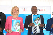 UNAid's acting executive director Gunilla Carlson holds up UNAids' global Aids update report with SA deputy president David Mabuza in Eshowe, northern KwaZulu-Natal, on Tuesday. 
