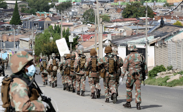 Soldiers patrol Alexandra, Johannesburg, to enforce the lockdown. There is now a call for a 'code' regulating the conduct of law-enforcement officials during the shutdown.