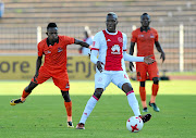 Tendai Ndoro of Ajax Cape Town  is challenged by Mondli Miya of Polokwane City during their PSL match   at  the Old Peter Mokaba Stadium in   February. 