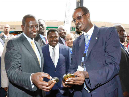 Deputy President William Ruto with Anti-Counterfeit Agency executive director Elema Halakhe during the opening of Kenya Market Week at the KICC in Nairobi, July 31, 2018. /DPPS