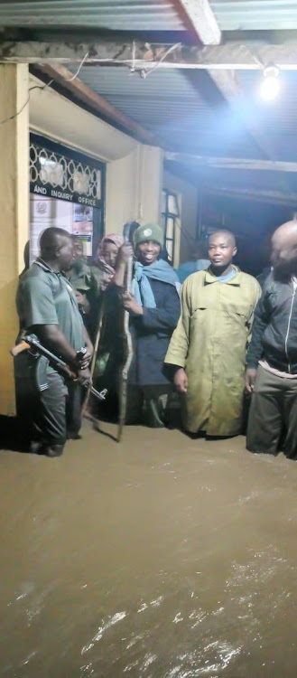 Police Officers marooned bhy floods at Ahero Police Station on May 5, 2024 after River Nyando broke its banks.