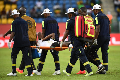 Ghana's defender Baba Rahman is carried off the pitch during the 2017 Africa Cup of Nations group D football match between Ghana and Uganda in Port-Gentil on January 17, 2017. Justin TALLIS / AFP