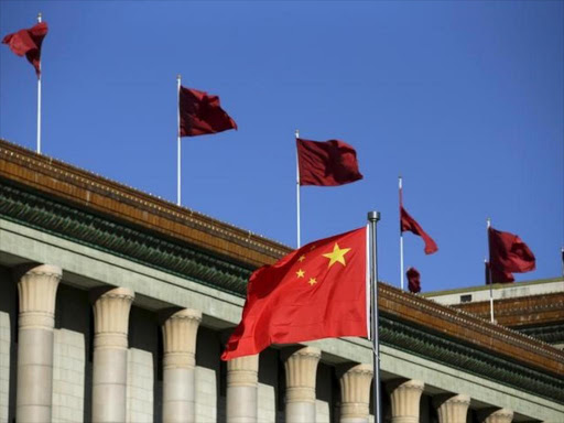 Chinese flag waves in front of the Great Hall of the People in Beijing, China, October 29, 2015. Photo/REUTERS