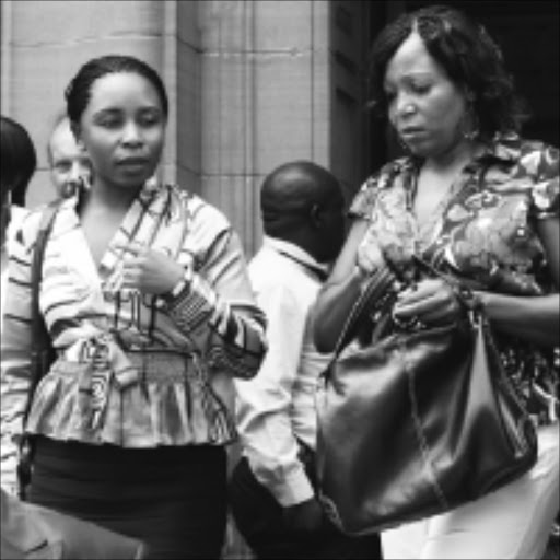 'BLACK WIDOW': Mulalo Sivhidzho, left, with her sister Humbulani Sivhidzho after her appearance at Johannesburg high court yesterday. PIC: ANTONIO MUCHAVE. 02/02/2010. © Sowetan.