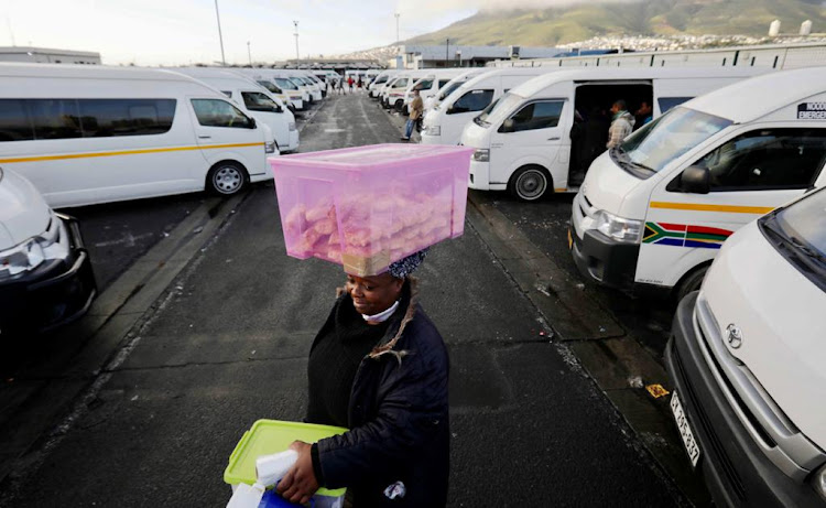 A woman selling biscuits at a Cape Town taxi rank carried on with no interruption, which was not the case for some street vendors in Gauteng, as the taxi industry there shut down on June 22 2020 after a stalemate with the government over the Covid-19 relief package.